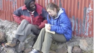 Laurentian interviewing a person in Kenya