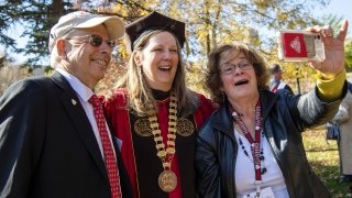 Saint Lawrence University President Kathryn Morris, laughs as she takes a selfie with fellow Laurentians.
