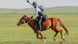 Mary Donohue riding a horse in the 2022 Mongol Derby