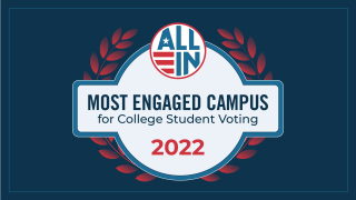 A graphic of a blue seal from the non-profit "All In." It reads "Most Engaged Campus for College Student Voting 2022."