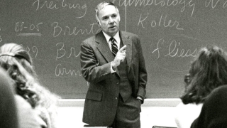 Former President Lawry Gulick teaching in front of a classroom of students