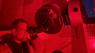 Tyler Karasinski at telescope