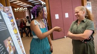 Sarath Novas chats with Sara Ashpole about her research project at Festival Day.
