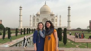 Two students standing in front of the Taj Mahal during their study abroad experience.