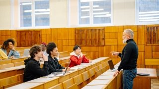 University professor instructing students