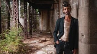 image of Jake Blount leaning against wall posing.
