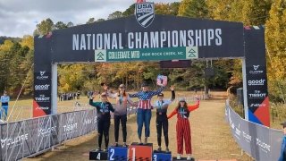 The podium with the first through fifth place winners of the downhill race at the National Collegiate Mountain Bike Championships.