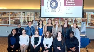 A group of people sitting for an induction ceremony