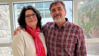 woman and man smiling for picture