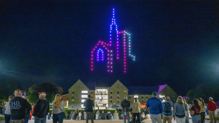 Drone light show at Saint Lawrence University featuring the University chapel