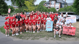 Orientation Leaders and student-athletes welcoming incoming first-years to their residence halls on move-in day