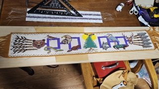 The Gathering of Nations, a stunning 42-inch beaded belt by Akwesasne Mohawk artists Kelly Tsieriwaiens Back and Tyson Karonhiahere Back from Fire Loom Creations.