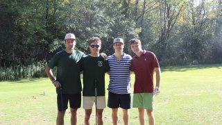 Four beta members on a golf course