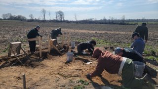 Students digging skeletal remains