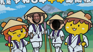 Dr. Mark MacWilliams posing with pilgrimage-themed characters during his summer 2026 trip to Japan
