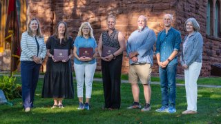 President Morris accompanied by 2026 faculty and staff award winners. 