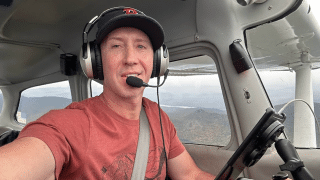 Nate Ward flying a plane.
