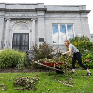 Student cleaning up brush