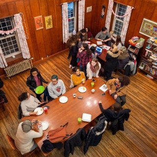Laurentians eating at tables