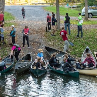 Relay teams with canoes