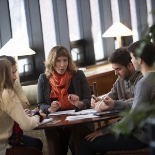 Students talking with professor