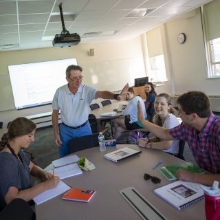 Faculty member with students