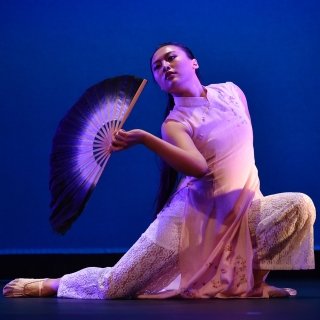 Student dancing on stage