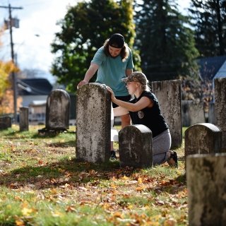 Students working in cemetery