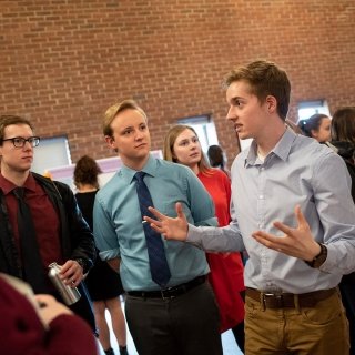 Colin Hart doing poster presentation