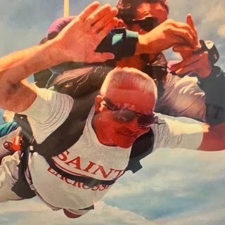Person Skydiving with Saints shirt