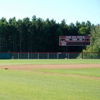View of outfield with scoreboard from home dugout