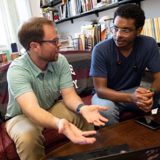 A Saint Lawrence student and professor meet to talk through an upcoming assignment.