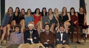 The residents of the Green House gather in formal attire for a group photo during an event in fall 2019.