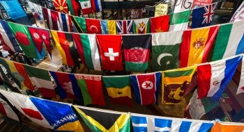 Sullivan Student Center decorated with flags representing several students' nationalities and heritage.