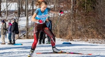 Lucy Hochshartner mid-stride during a Nordic ski competition.