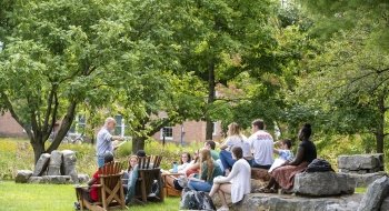 A Saint Lawrence University professor teaches a class outside.