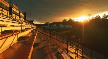 A glorious sun set over the empty bleachers overlooking athletic fields on the Saint Lawrence campus.