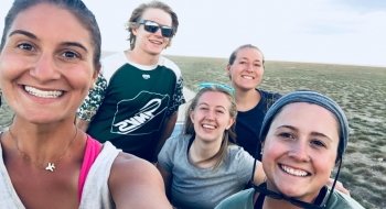Five Saint Lawrence University students stand together for a photo.