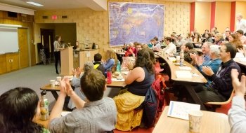 Emily Metzger presents research, to a lecture hall full of attendees, during the Festival of Scholarship at St. Lawrence University.