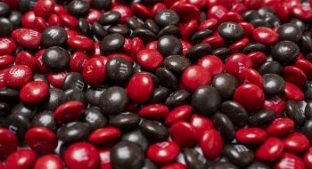 Up-close with a lot of red and brown M and Ms.