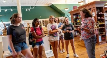 Jill Breit converses with five Saint Lawrence University students at the Traditional Arts in Upstate New York Center in Canton, New York.