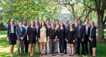 Several Saint Lawrence University students and two faculty members, who participated in the New York Fed challenge, gather on the quad.