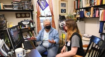 Aileen O'Donoghue and Haille Perkins sit in O'Donoghue's office and discuss their research project.
