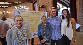 Sam Heikkinnen, Claire Anderson, Alex LaMantia, and Kayla Nielsen present their public health-related research, “Addressing the Opioid Epidemic in St. Lawrence County,” during St. Lawrence University’s Festival Day in April 2017.