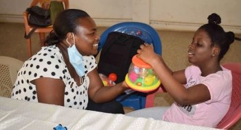 Adwoa Pokuaa Boateng works with a child as part of her Project for Peace, Cerebral Palsy Therapies on Wheels.