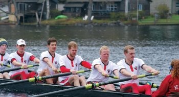 A photo of the men's rowing team in action.