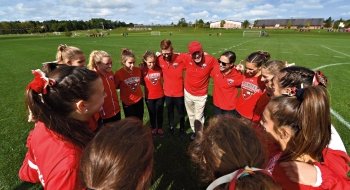 Cross Country team in a circle