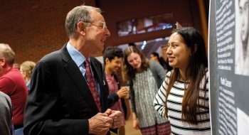 President Fox speaking to a student