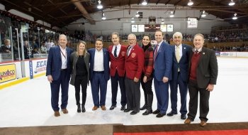A photo of everyone being recognized on the ice.