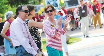 A photo of William and Lynn Fox outside celebrating.